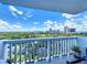 Enjoy a stunning cityscape from this condo balcony, with lush green trees, and fluffy clouds at 400 E Colonial Dr # 1501, Orlando, FL 32803