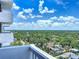 Enjoy a serene, tree-filled cityscape view from this condo balcony, perfect for relaxation and contemplation at 400 E Colonial Dr # 1501, Orlando, FL 32803