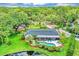 Aerial view of home with private pool, expansive yard, and serene lake views at 400 Timbercove Pl, Longwood, FL 32779