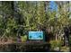 The Riverbend Park entrance sign surrounded by lush greenery and landscaping at 400 Timbercove Pl, Longwood, FL 32779