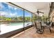 Enclosed patio with tile floors, ceiling fans, and tranquil views of the pool and backyard at 400 Timbercove Pl, Longwood, FL 32779