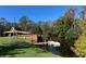 A park pavilion with a wooden dock extending into the water, surrounded by green lawns and trees at 400 Timbercove Pl, Longwood, FL 32779
