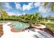 Private backyard swimming pool and hot tub area with lush landscaping and serene lake views at 400 Timbercove Pl, Longwood, FL 32779