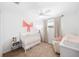 Cozy Bedroom with crib, chair, neutral decor and plenty of natural light at 417 Monticello Dr, Altamonte Springs, FL 32701