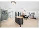 Dining area featuring a stylish chandelier, a dining table with green chairs, and a decorative buffet at 417 Monticello Dr, Altamonte Springs, FL 32701