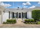 Charming front exterior featuring a green yard, a brick house, and black shutters at 417 Monticello Dr, Altamonte Springs, FL 32701