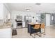 Bright kitchen with white cabinets, stainless steel appliances, granite counters, and a central island with seating at 417 Monticello Dr, Altamonte Springs, FL 32701