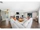 Bright living room with hardwood floors, a fireplace, and sliding barn doors to another room at 417 Monticello Dr, Altamonte Springs, FL 32701