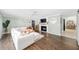 Bright living room with hardwood floors, a fireplace, and sliding barn doors to another room at 417 Monticello Dr, Altamonte Springs, FL 32701