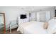 Bright bedroom with a white dresser, TV, and a decorative chair at 417 Monticello Dr, Altamonte Springs, FL 32701