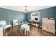 This home office features a desk, chair, a computer, a printer and a small playset at 417 Monticello Dr, Altamonte Springs, FL 32701
