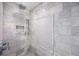 Luxurious shower stall with rainfall showerhead and decorative marble tile at 417 Monticello Dr, Altamonte Springs, FL 32701