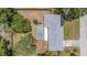 Aerial view of a private home with a screened pool, surrounded by mature trees at 419 W Orange St, Altamonte Springs, FL 32714
