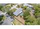 Aerial view of a home with screened pool, solar panels, and a fenced yard at 419 W Orange St, Altamonte Springs, FL 32714