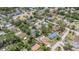 An aerial view of a residential neighborhood featuring mature trees and homes with pools at 419 W Orange St, Altamonte Springs, FL 32714