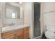 Updated bathroom features marble vanity, decorative mirror and a shower stall at 419 W Orange St, Altamonte Springs, FL 32714