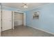 Tiled bedroom featuring a large window and closet at 419 W Orange St, Altamonte Springs, FL 32714