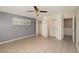 Bedroom featuring tile flooring, ceiling fan and double closets for storage at 419 W Orange St, Altamonte Springs, FL 32714