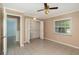 Neutrally painted bedroom with closet and tile flooring at 419 W Orange St, Altamonte Springs, FL 32714