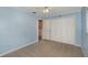 Cozy bedroom with pale blue walls, white trim, tiled flooring, and closet at 419 W Orange St, Altamonte Springs, FL 32714