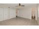 Empty bedroom features tile flooring, ceiling fan and three separate closets at 419 W Orange St, Altamonte Springs, FL 32714