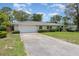 Attractive home with a large driveway, two-car garage, and arched entryway at 419 W Orange St, Altamonte Springs, FL 32714