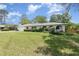 Well-kept residence featuring a manicured lawn, attached garage, and a covered front entry at 419 W Orange St, Altamonte Springs, FL 32714