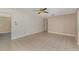 Spacious living room with tile flooring, neutral paint and a ceiling fan at 419 W Orange St, Altamonte Springs, FL 32714