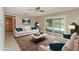 Bright living room with pool view through sliding glass doors and comfortable, modern furniture at 419 W Orange St, Altamonte Springs, FL 32714