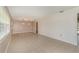 Bright living room featuring tile floors and stylish pendant lighting above a decorative floor accent at 419 W Orange St, Altamonte Springs, FL 32714