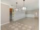 Open-concept living area with tile flooring, pendant lights, and easy access to the kitchen at 419 W Orange St, Altamonte Springs, FL 32714