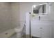 Updated bathroom with modern fixtures, toilet and walk-in shower with decorative tile at 438 Romano Ave, Orlando, FL 32807