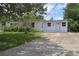 Inviting single-story home featuring a well-maintained lawn and a neutral color palette at 438 Romano Ave, Orlando, FL 32807