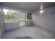 Enclosed lanai featuring screens and a concrete floor at 438 Romano Ave, Orlando, FL 32807
