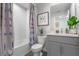 Well-lit bathroom featuring a tub and shower, a modern vanity, and neutral, soothing colors at 5641 Brosnan Rd, St Cloud, FL 34771