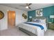 Inviting bedroom showcasing a modern accent wall, a comfortable bed, and stylish bedside decor and furnishings at 5641 Brosnan Rd, St Cloud, FL 34771