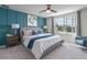 Comfortable bedroom with paneled accent wall, soft lighting, and a comfortable bed, perfect for relaxation at 5641 Brosnan Rd, St Cloud, FL 34771