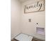 Minimalist laundry area with a sleek 'Gathering' sign, essential hookups, and clean, modern design at 5641 Brosnan Rd, St Cloud, FL 34771