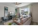Bright living room with large windows, comfortable seating, and stylish decor at 5641 Brosnan Rd, St Cloud, FL 34771