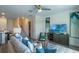 Open-concept living room with modern decor and staircase access at 5641 Brosnan Rd, St Cloud, FL 34771