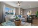 Comfortable living room featuring a large window, stylish decor, and inviting seating at 5641 Brosnan Rd, St Cloud, FL 34771