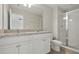 Bathroom featuring double sinks, granite vanity, and glass shower at 600 Northern Way # 607, Winter Springs, FL 32708