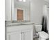 Bathroom featuring a granite vanity top, white cabinetry, toilet, and shower with curtain at 600 Northern Way # 607, Winter Springs, FL 32708