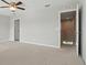 Spacious bedroom featuring plush carpeting, ceiling fan, and neutral paint palette at 600 Northern Way # 607, Winter Springs, FL 32708