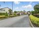 Gated community entrance featuring well-maintained landscaping and secure access for residents at 600 Northern Way # 607, Winter Springs, FL 32708