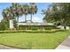 Elegant community entrance with manicured landscaping and signage, showcasing a welcoming atmosphere at 600 Northern Way # 607, Winter Springs, FL 32708