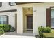 The front entry features a covered entrance and well-maintained landscaping at 600 Northern Way # 607, Winter Springs, FL 32708