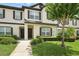 Charming townhouse exterior featuring manicured landscaping and a welcoming entrance at 600 Northern Way # 607, Winter Springs, FL 32708