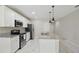 Modern kitchen with granite counters, stainless steel appliances and center island at 600 Northern Way # 607, Winter Springs, FL 32708