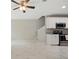 Open layout featuring a kitchen with stainless steel appliances, white cabinets, and marble flooring at 600 Northern Way # 607, Winter Springs, FL 32708